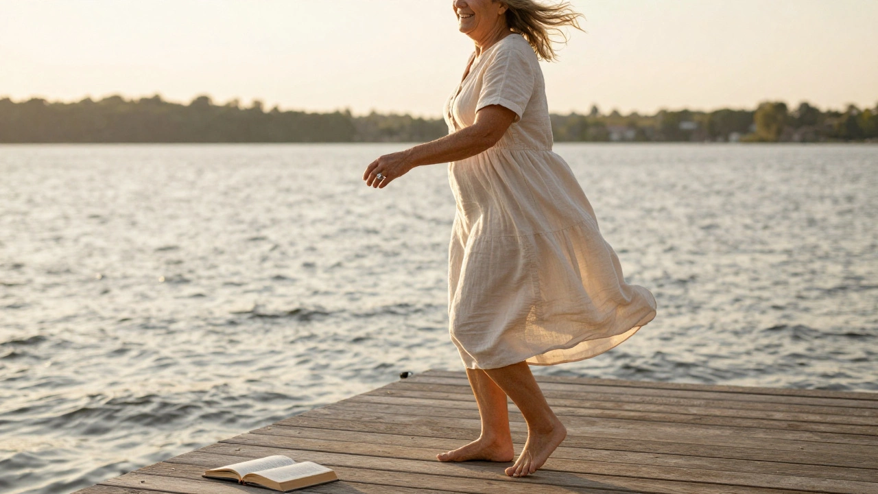 A senior laughs while twirling barefoot on a lakeside dock at golden hour, wind in their hair, holding a book.