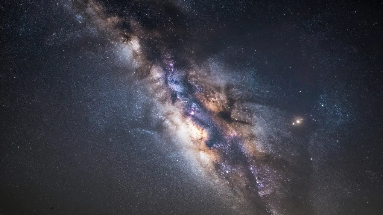 Close-up view of the Milky Way core showing sharp stars and colorful nebulae