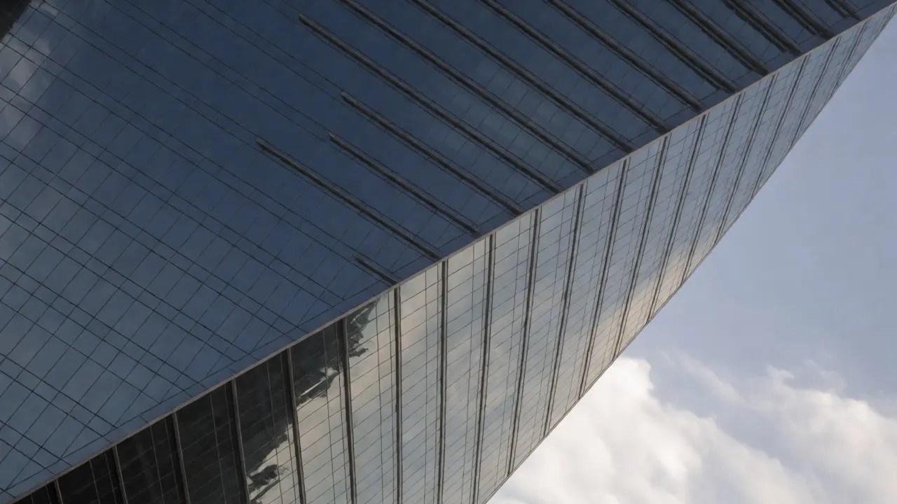 Skyscraper facade with strong diagonal architectural lines